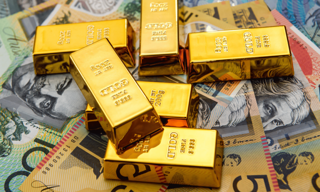 Gold Bars laying on top of currencies